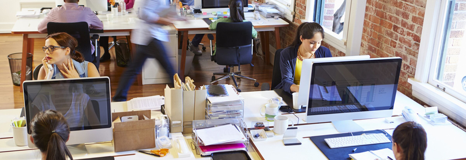 People working in a open floor plan office