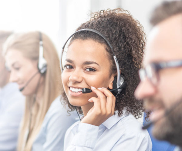 Customer service people sitting in a row